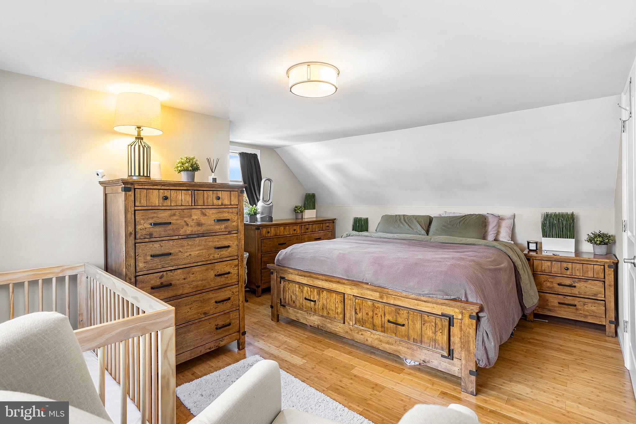 48 Falmouth Road Hamilton, NJ 08620 - Photo 23 of 34 a spacious bedroom with a bed and a cabinets