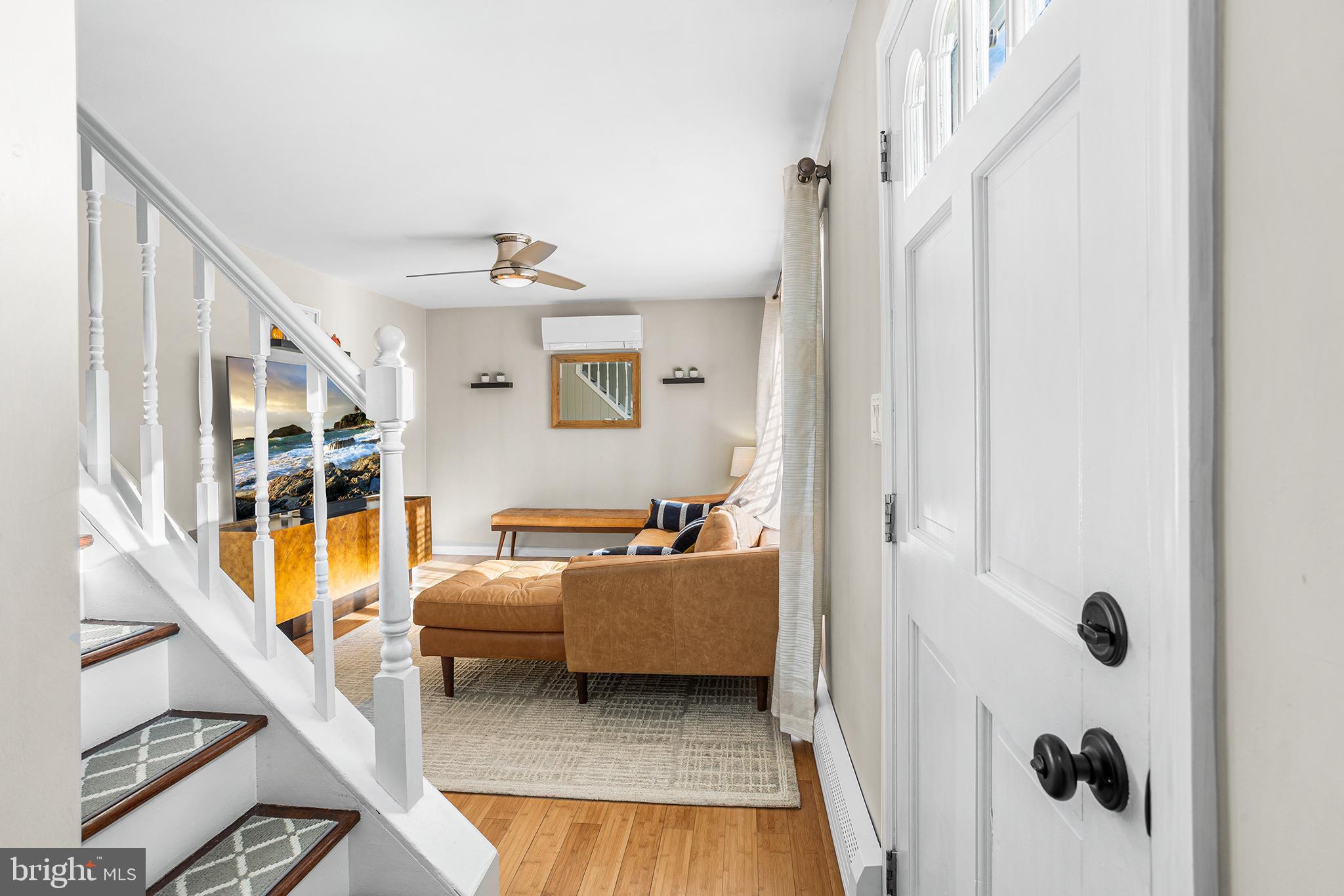 48 Falmouth Road Hamilton, NJ 08620 - Photo 3 of 34 a living room with a bed and a chandelier