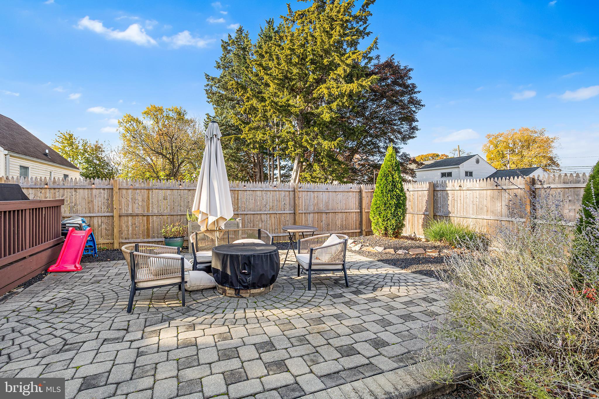 48 Falmouth Road Hamilton, NJ 08620 - Photo 32 of 34 a backyard of a house with table and chairs