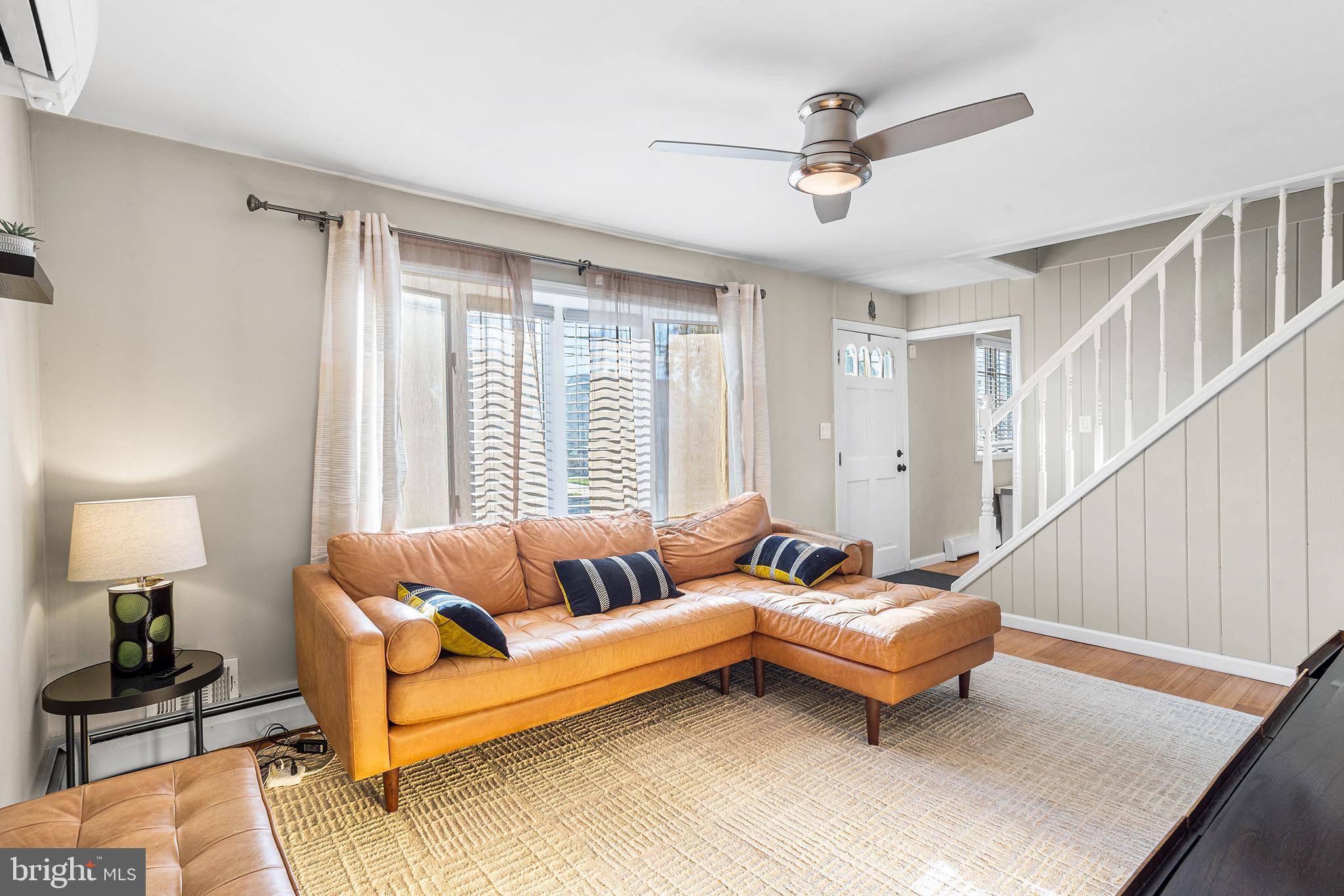 48 Falmouth Road Hamilton, NJ 08620 - Photo 5 of 34 a living room with furniture and a ceiling fan