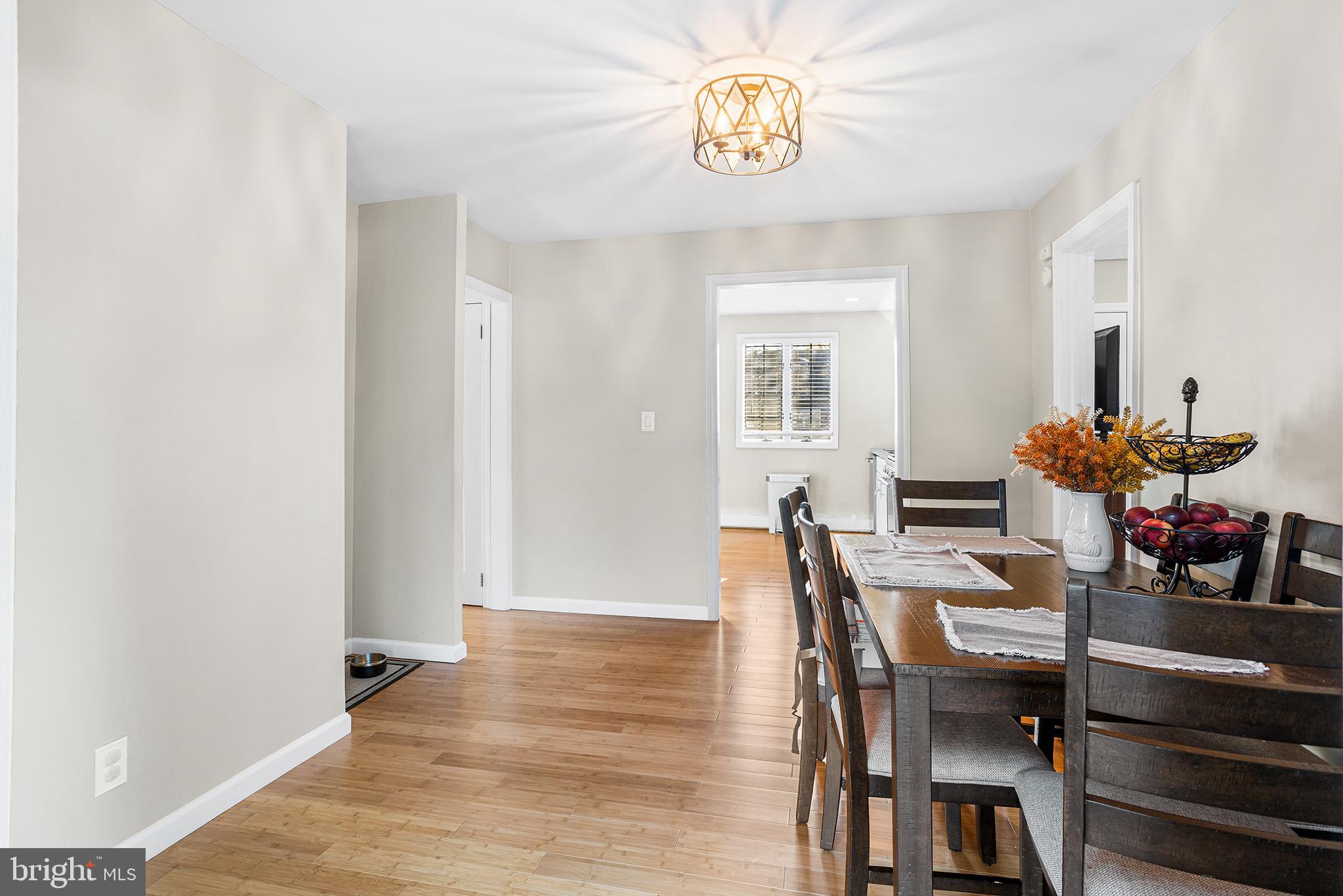 48 Falmouth Road Hamilton, NJ 08620 - Photo 10 of 34 a view of a dining room with furniture and wooden floor
