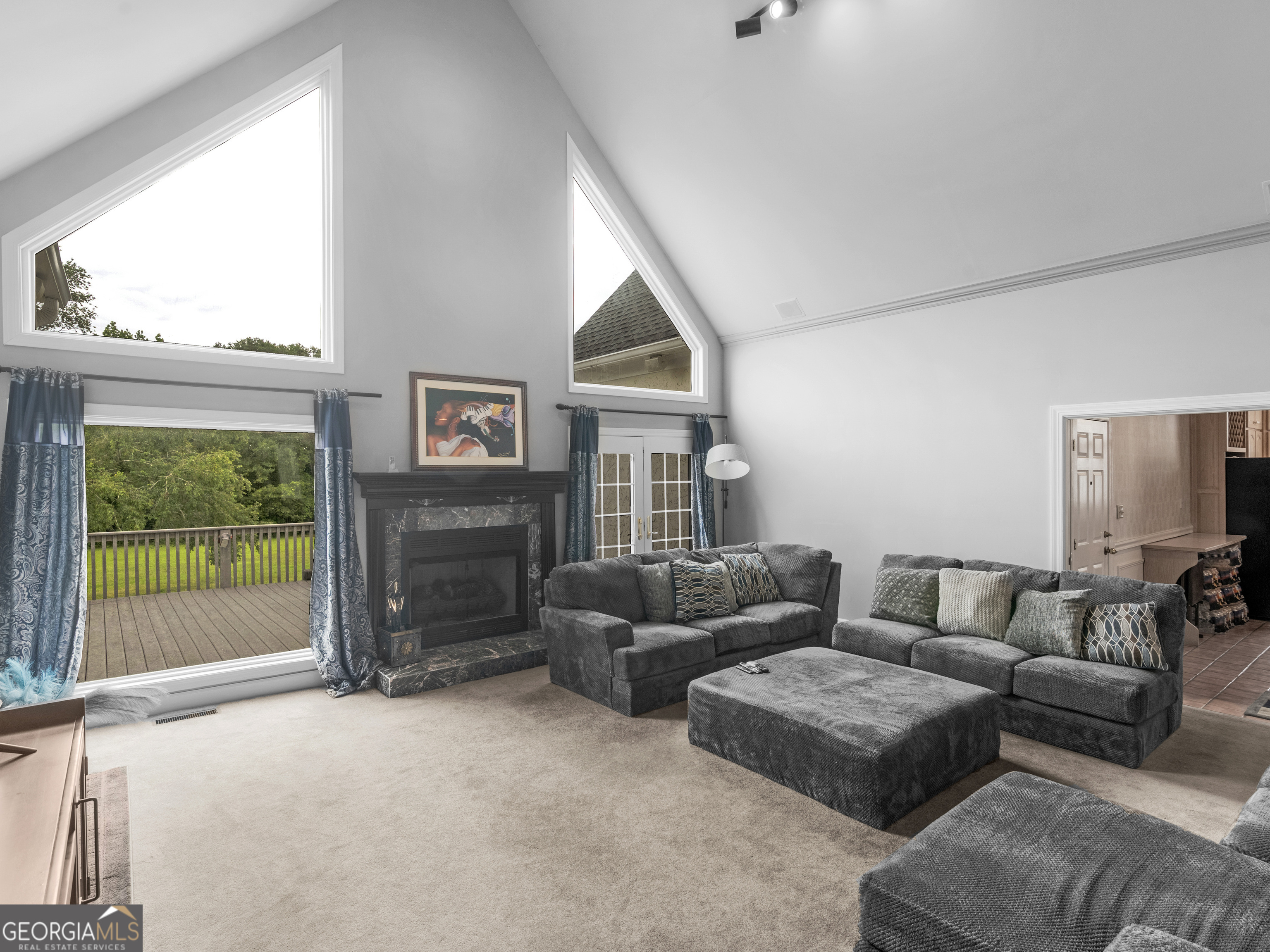 474 North Rover Road Williamson, GA 30292 - Photo 19 of 89 a living room with furniture and a flat screen tv
