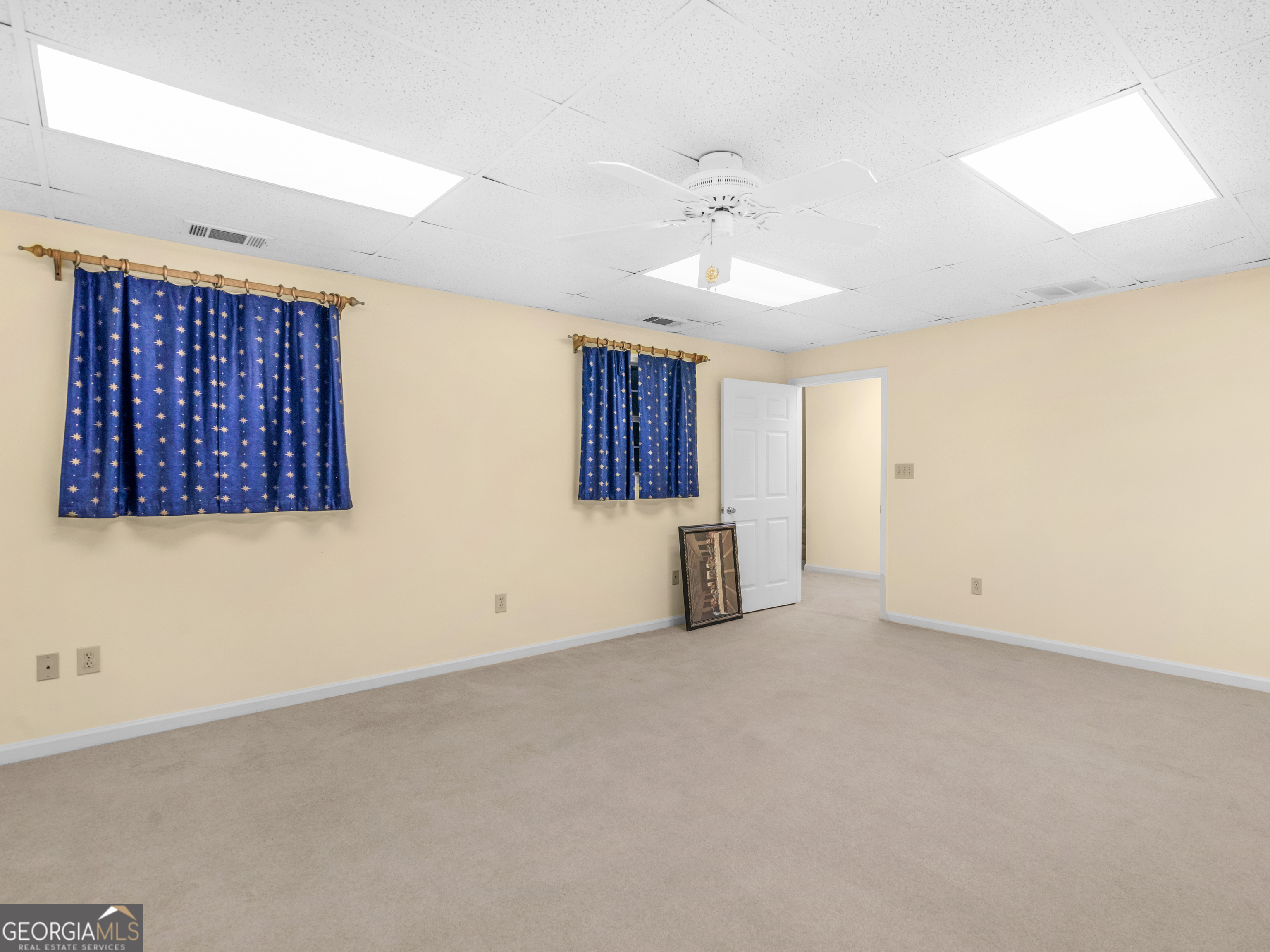 474 North Rover Road Williamson, GA 30292 - Photo 68 of 89 an empty room with a ceiling fan and window