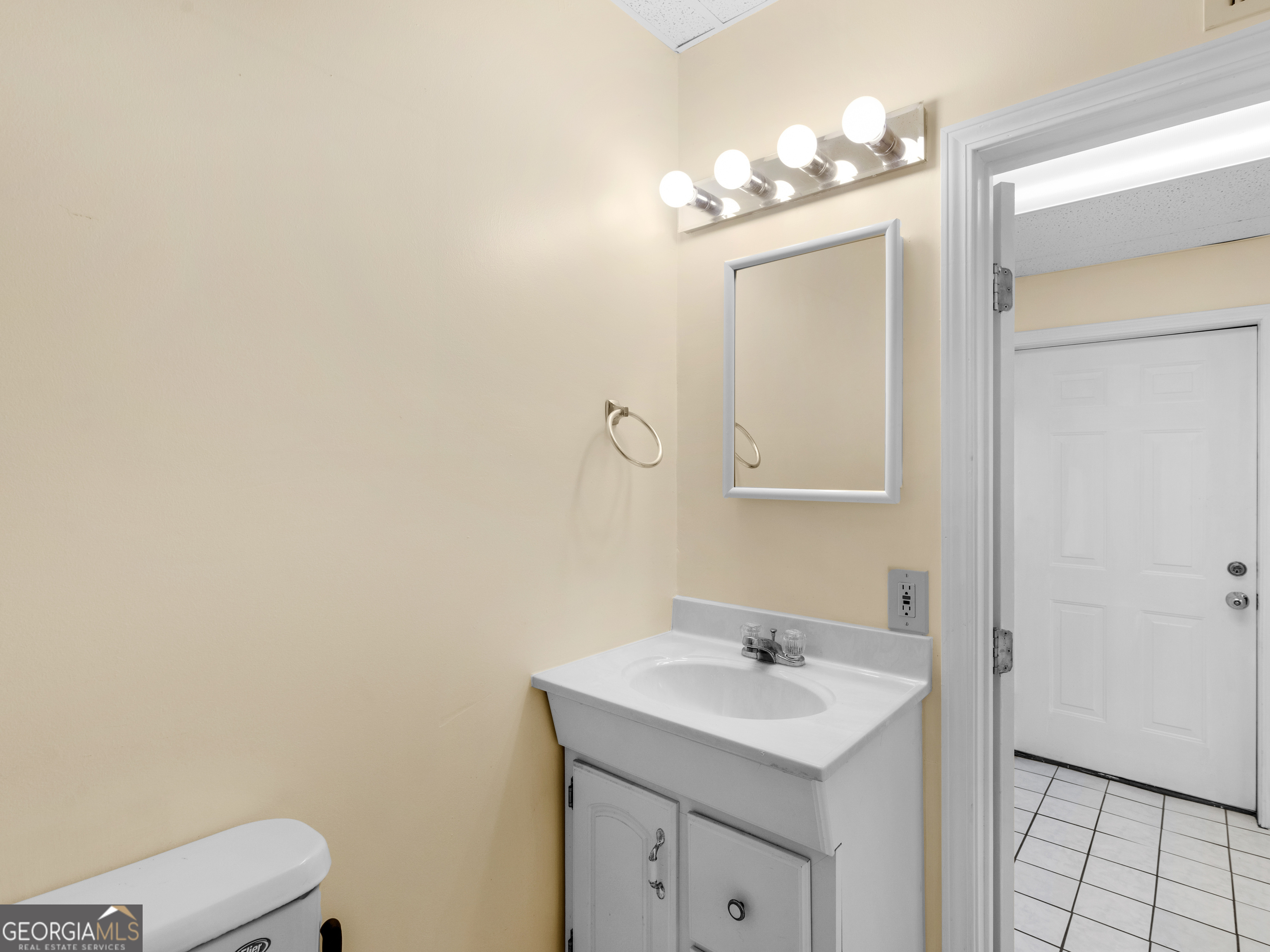 474 North Rover Road Williamson, GA 30292 - Photo 71 of 89 a bathroom with a sink a toilet and mirror