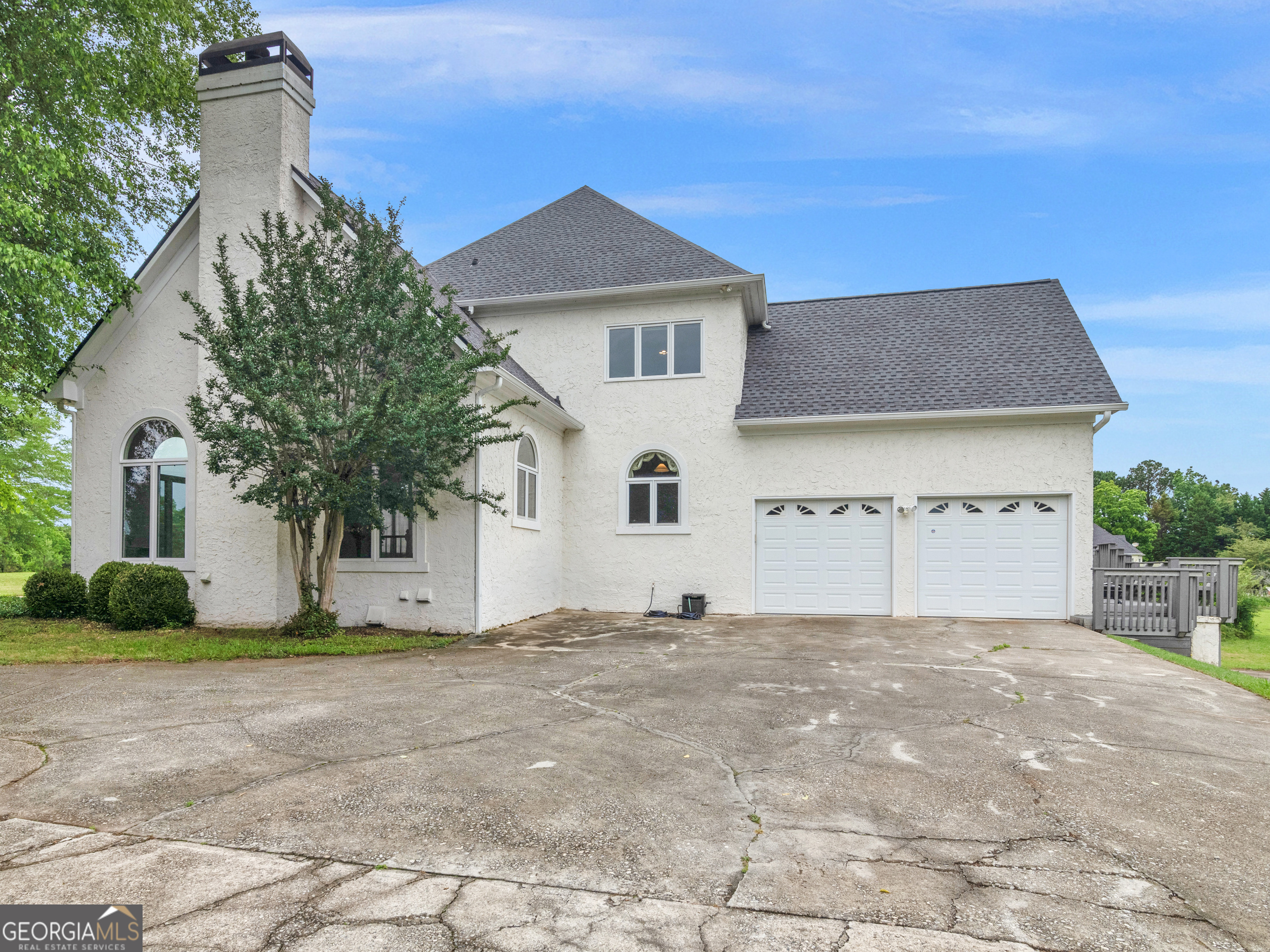 474 North Rover Road Williamson, GA 30292 - Photo 75 of 89 a house with lots of trees in the background