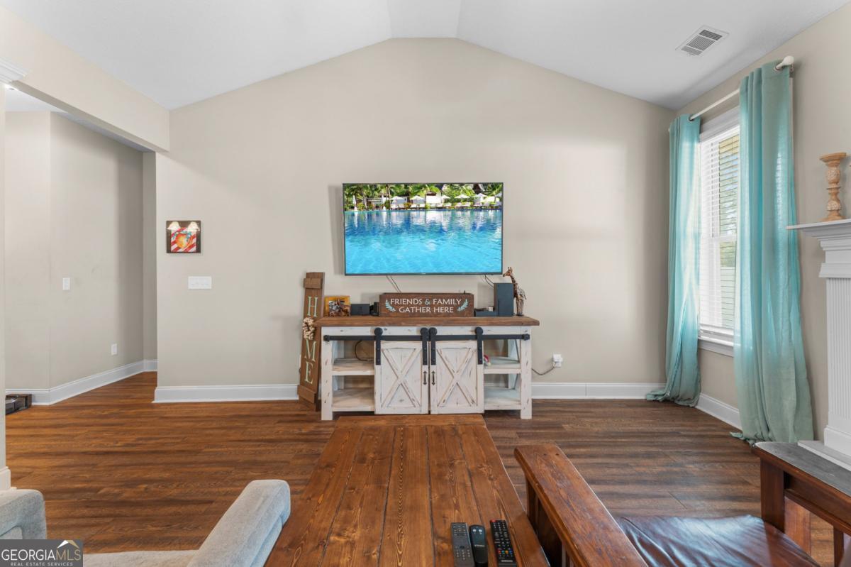 161 Laguna Way Savannah, GA 31405 - Photo 17 of 33 a view of a livingroom with furniture and wooden floor