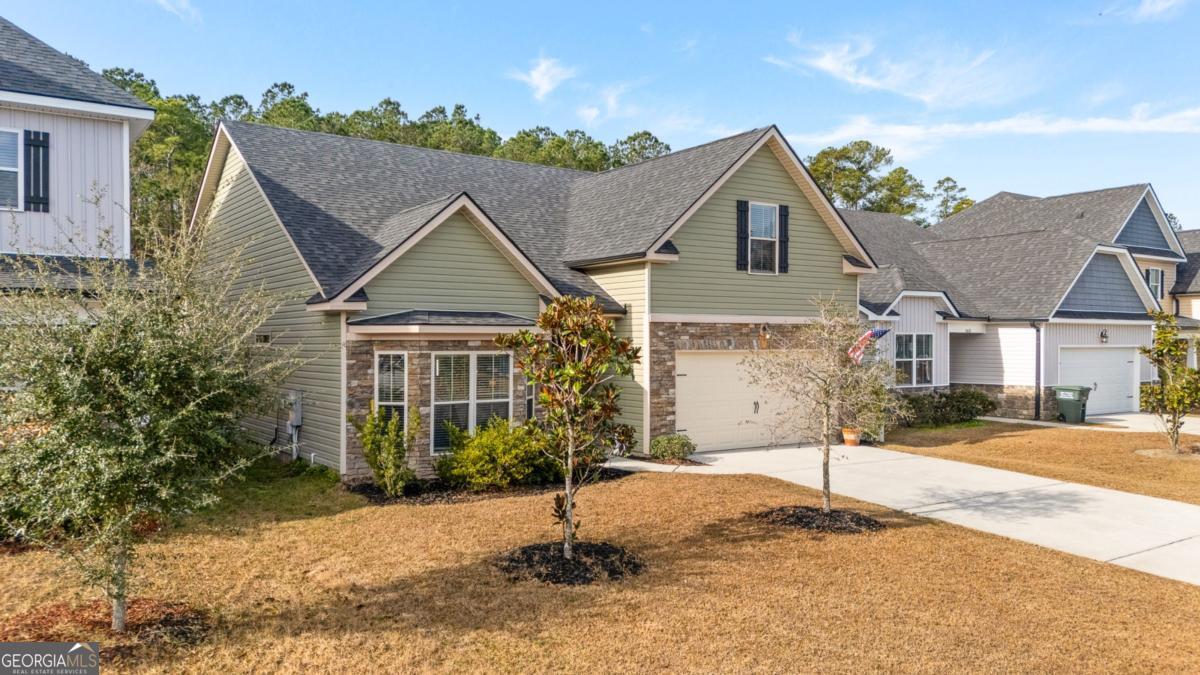 161 Laguna Way Savannah, GA 31405 - Photo 2 of 33 a front view of a house with a yard