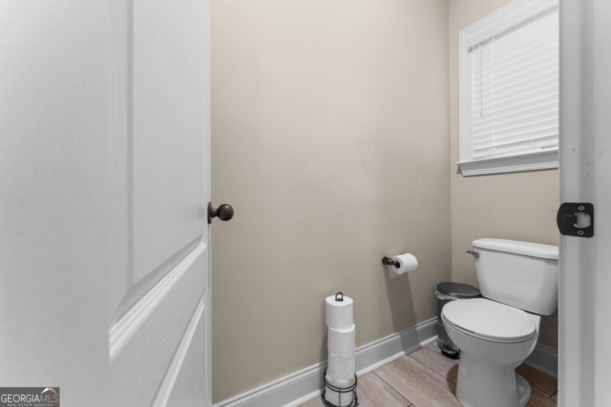 161 Laguna Way Savannah, GA 31405 - Photo 22 of 33 a white toilet sitting next to a window