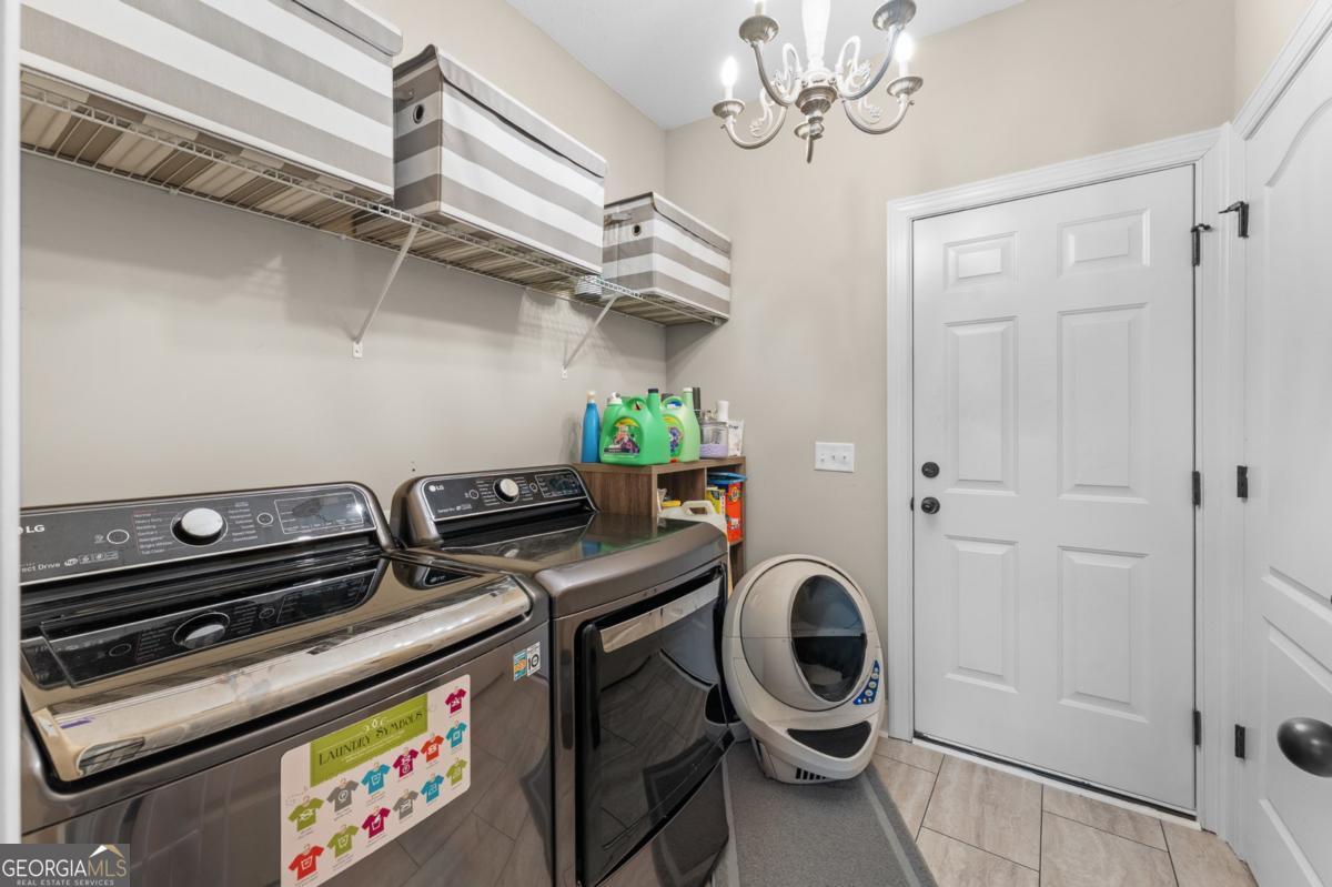 161 Laguna Way Savannah, GA 31405 - Photo 30 of 33 a utility room with dryer and washer