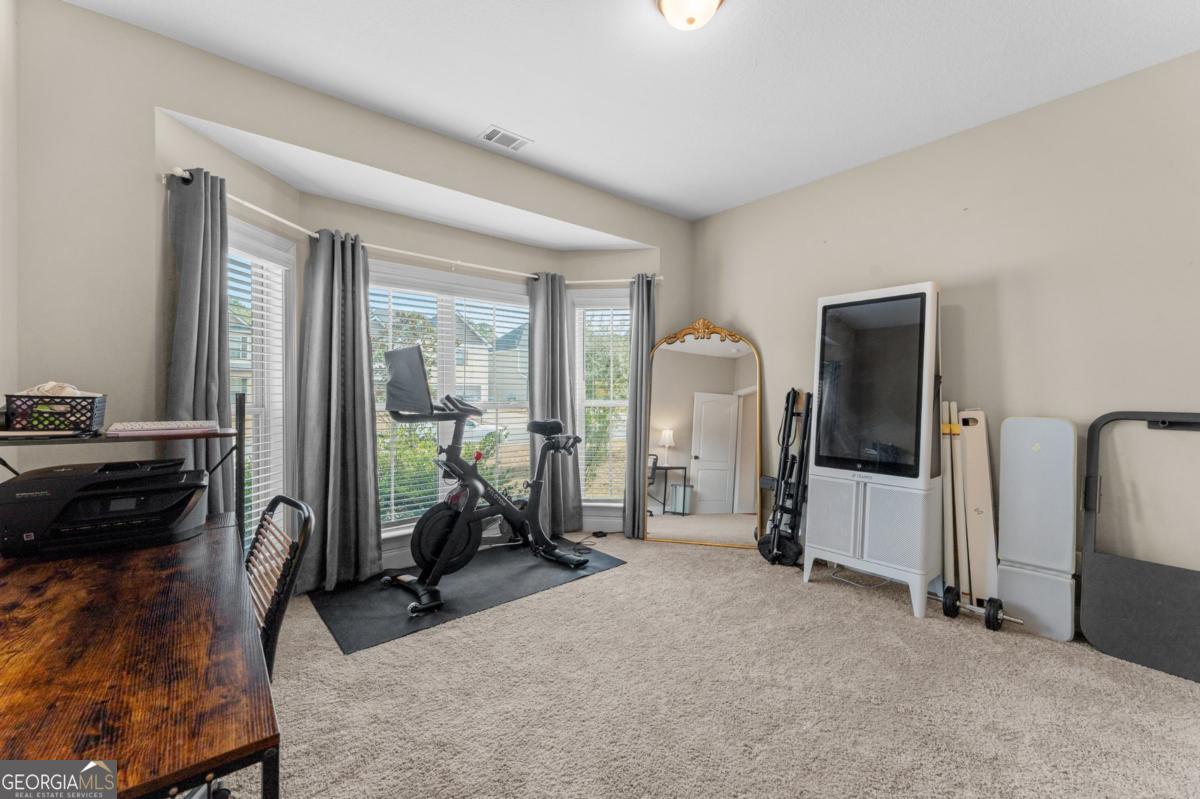 161 Laguna Way Savannah, GA 31405 - Photo 6 of 33 a view of a room with gym equipment