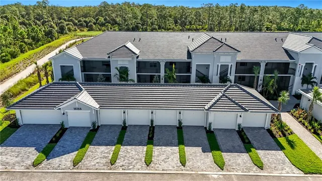 a view of a white house with a yard