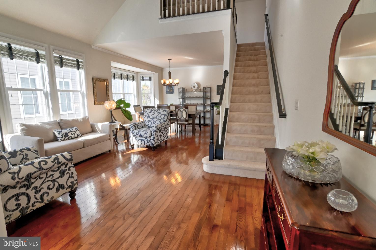13170 Triple Crown Loop Gainesville, VA 20155 - Photo 14 of 71 a living room with furniture and wooden floor