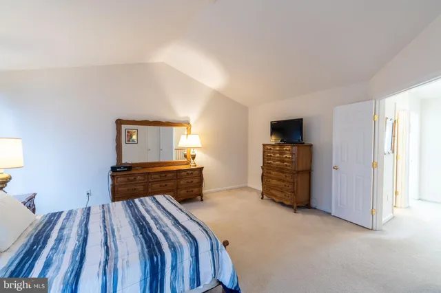 a bedroom with a bed and furniture