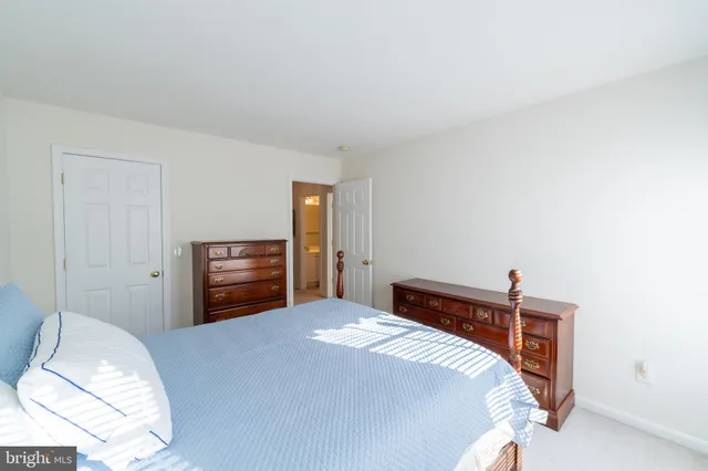 a bedroom with a bed and a television