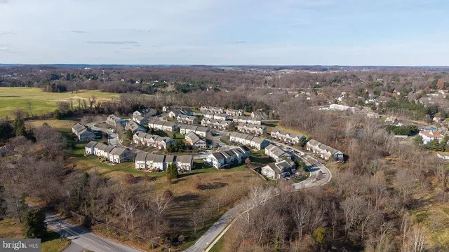 an aerial view of residential building and trees around