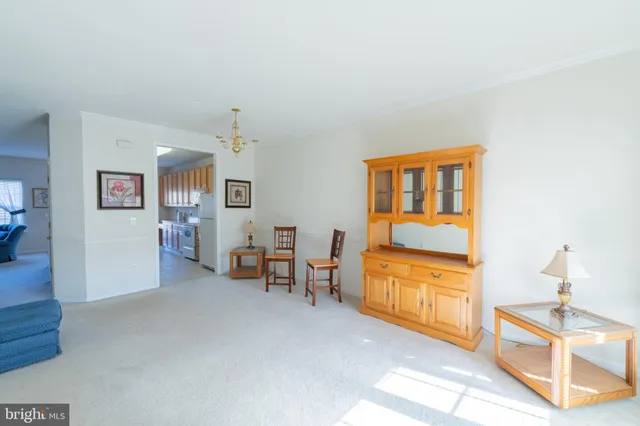 a view of a livingroom with furniture and a window