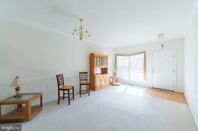 a view of a livingroom with furniture and windows