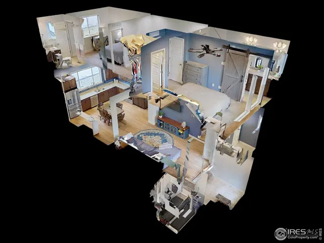 an aerial view of a house with a table and chairs