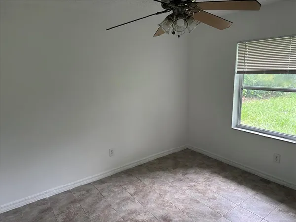 a view of a room that has a window in it