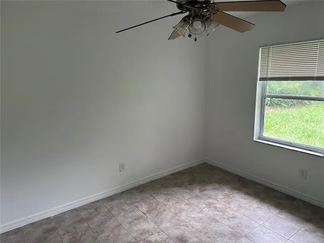 a view of a room that has a window in it