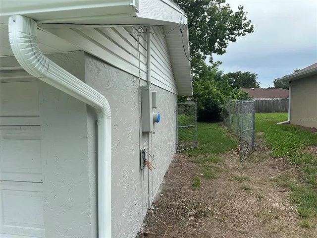 a view of a back yard of the house