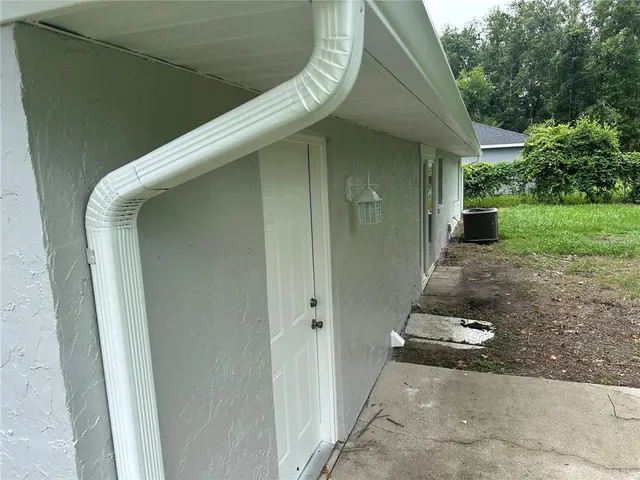 a backyard of a house with seating space