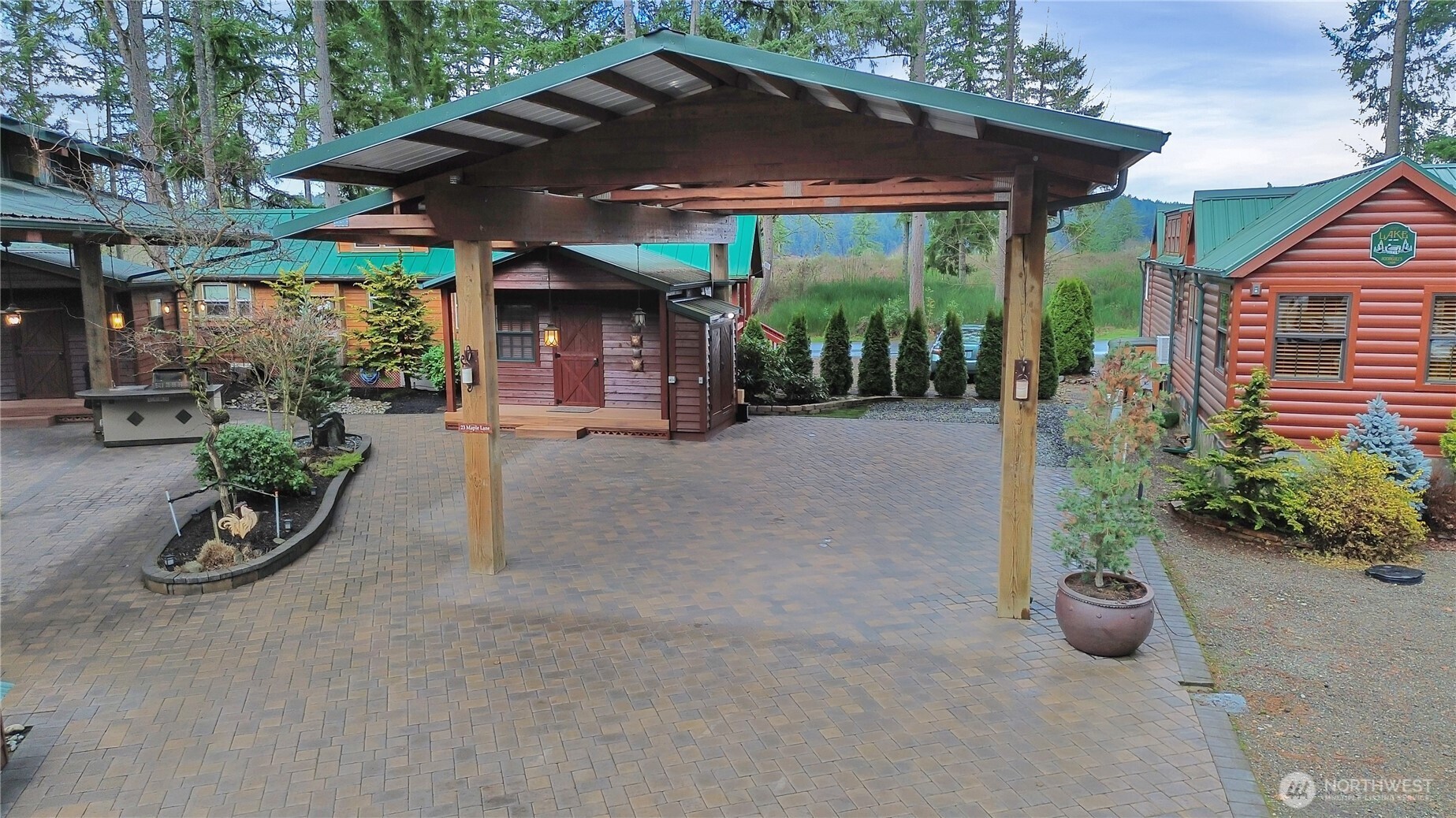 1546 Reservation Road Southeast, Unit 248 Olympia, WA 98513 - Photo 13 of 29 a view of a patio with table and chairs under an umbrella
