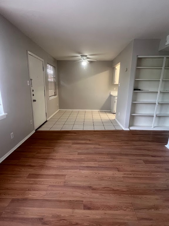 307 East 31st Street, Unit 208 Austin, TX 78705 - Photo 11 of 25 a view of empty room with wooden floor and window