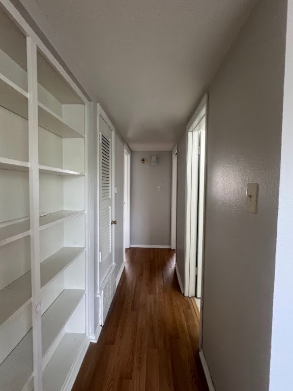 307 East 31st Street, Unit 208 Austin, TX 78705 - Photo 14 of 25 a view of a hallway with wooden floor and closet