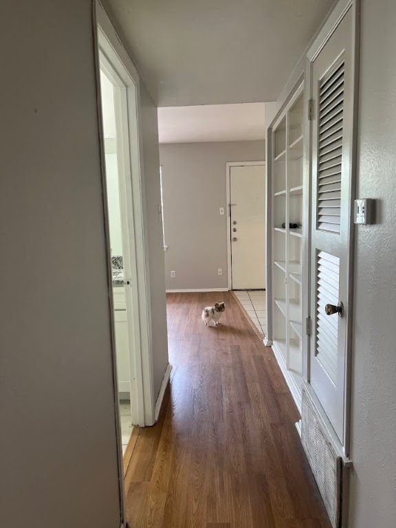 307 East 31st Street, Unit 208 Austin, TX 78705 - Photo 15 of 25 a view of a hallway with wooden floor and closet