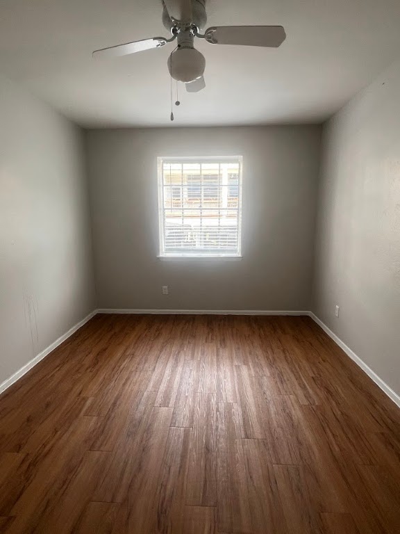 307 East 31st Street, Unit 208 Austin, TX 78705 - Photo 20 of 25 wooden floor in an empty room with a window