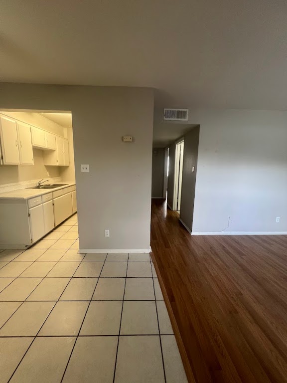 307 East 31st Street, Unit 208 Austin, TX 78705 - Photo 2 of 25 a view of a hallway with wooden floor and cabinet