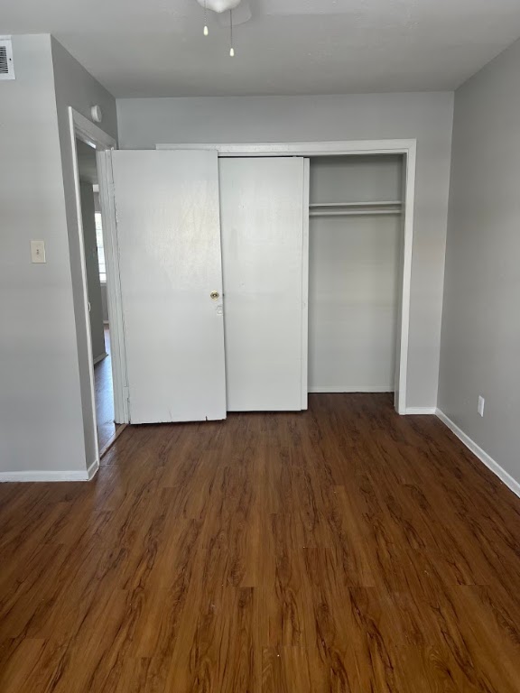 307 East 31st Street, Unit 208 Austin, TX 78705 - Photo 25 of 25 a view of an empty room with wooden floor and a window