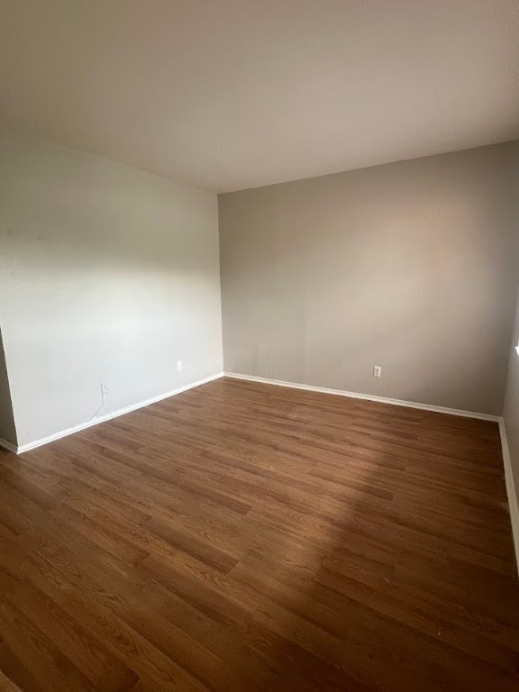 307 East 31st Street, Unit 208 Austin, TX 78705 - Photo 4 of 25 a view of empty room with wooden floor
