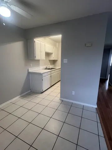 a kitchen with a stove a sink and a refrigerator