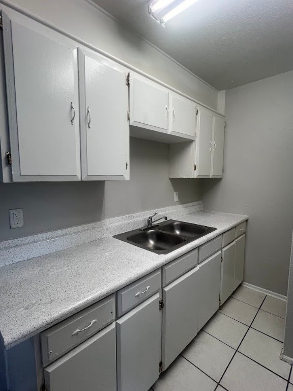 307 East 31st Street, Unit 208 Austin, TX 78705 - Photo 8 of 25 a kitchen with granite countertop a stove sink and cabinets