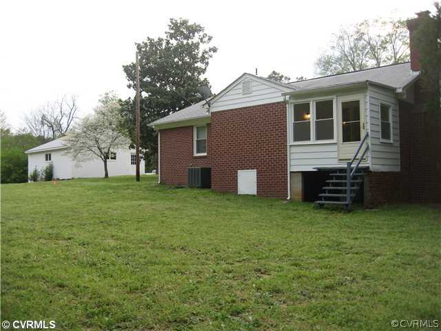 11238 Hanover Courthouse Road Mechanicsville, VA 23116 - Photo 11 of 12 a view of a house with a backyard