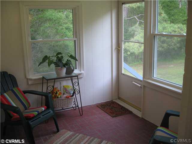 11238 Hanover Courthouse Road Mechanicsville, VA 23116 - Photo 12 of 12 a room with furniture and a window