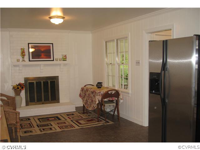 11238 Hanover Courthouse Road Mechanicsville, VA 23116 - Photo 4 of 12 a living room with furniture and a fireplace