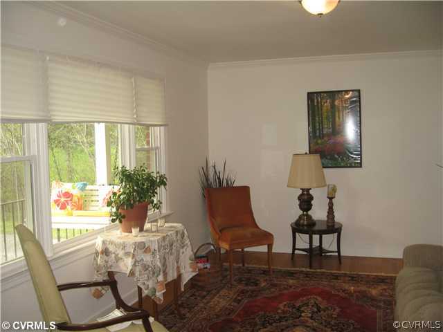 11238 Hanover Courthouse Road Mechanicsville, VA 23116 - Photo 6 of 12 a living room with furniture and a window