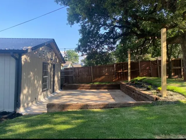 a backyard of a house with lots of green space