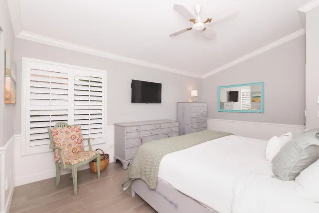 a bedroom with a bed and a chair