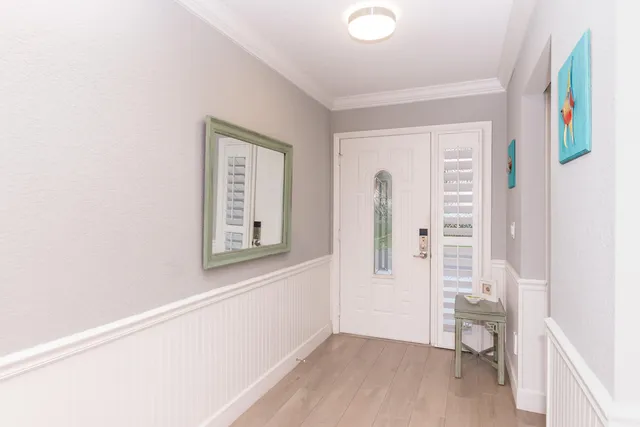 a view of room with window and wooden floor