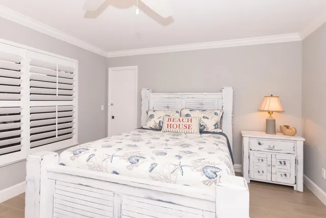 a bedroom with a bed and a dresser