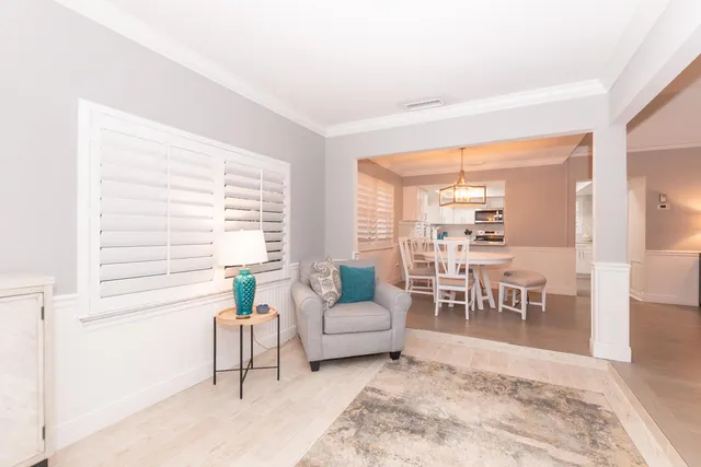 a living room with furniture and a table