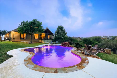 a view of swimming pool with outdoor seating