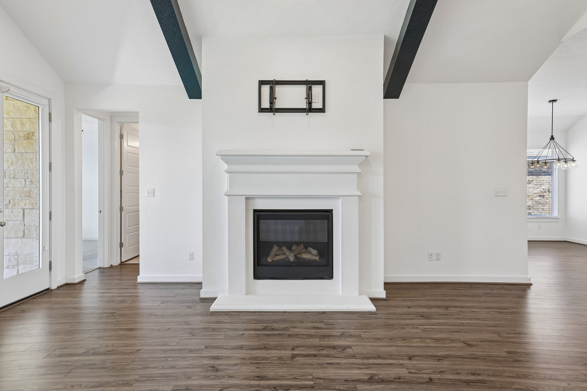 317 Independence Drive Kyle, TX 78640 - Photo 13 of 40 a living room with a fireplace and wooden floor