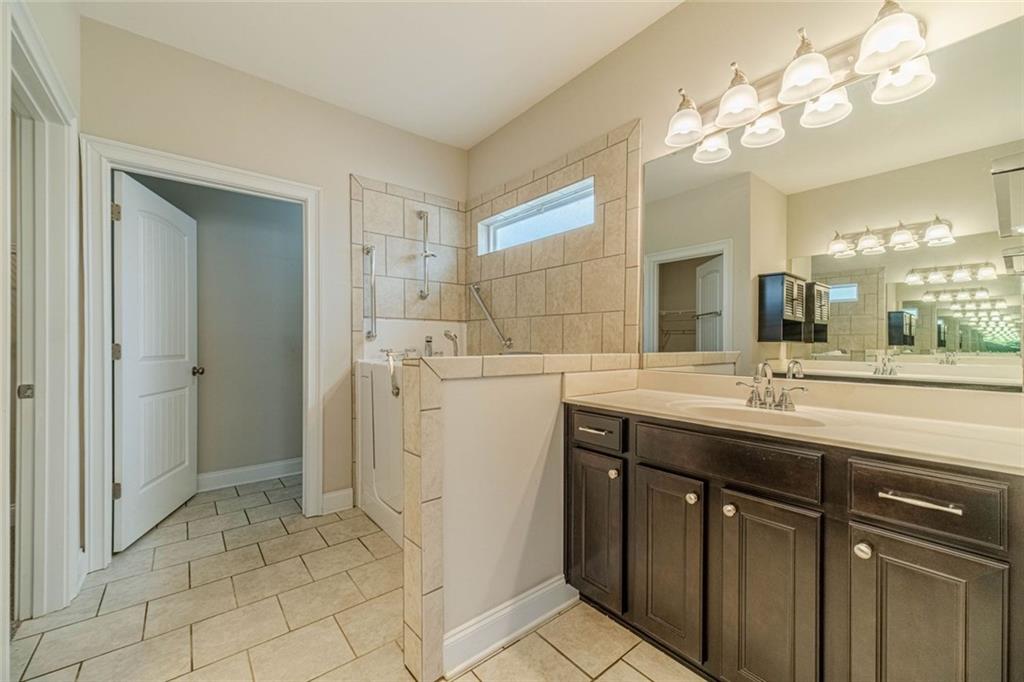 347 Villa Park Circle Stone Mountain, GA 30087 - Photo 14 of 25 a bathroom with a sink and a mirror