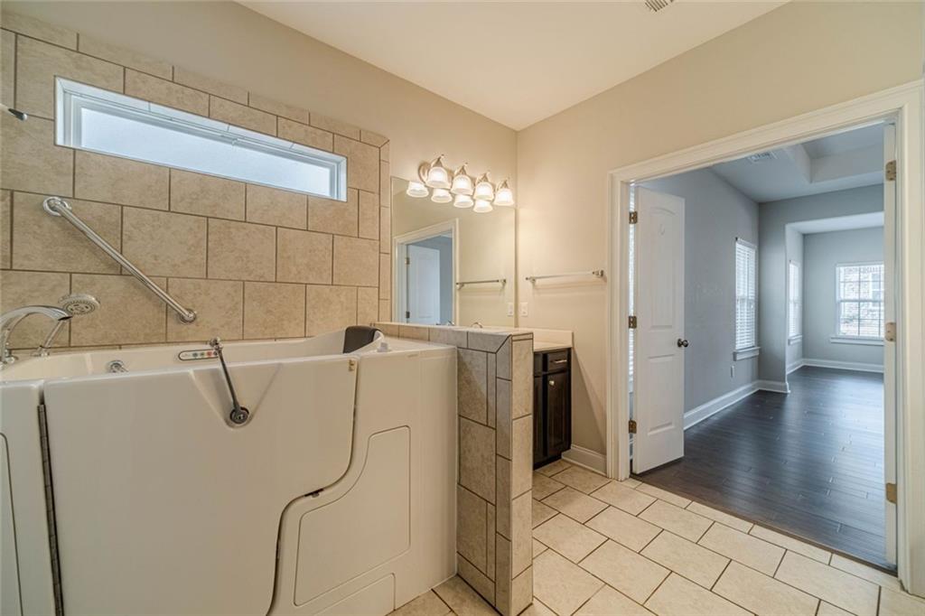 347 Villa Park Circle Stone Mountain, GA 30087 - Photo 16 of 25 a bathroom with a shower and a sink