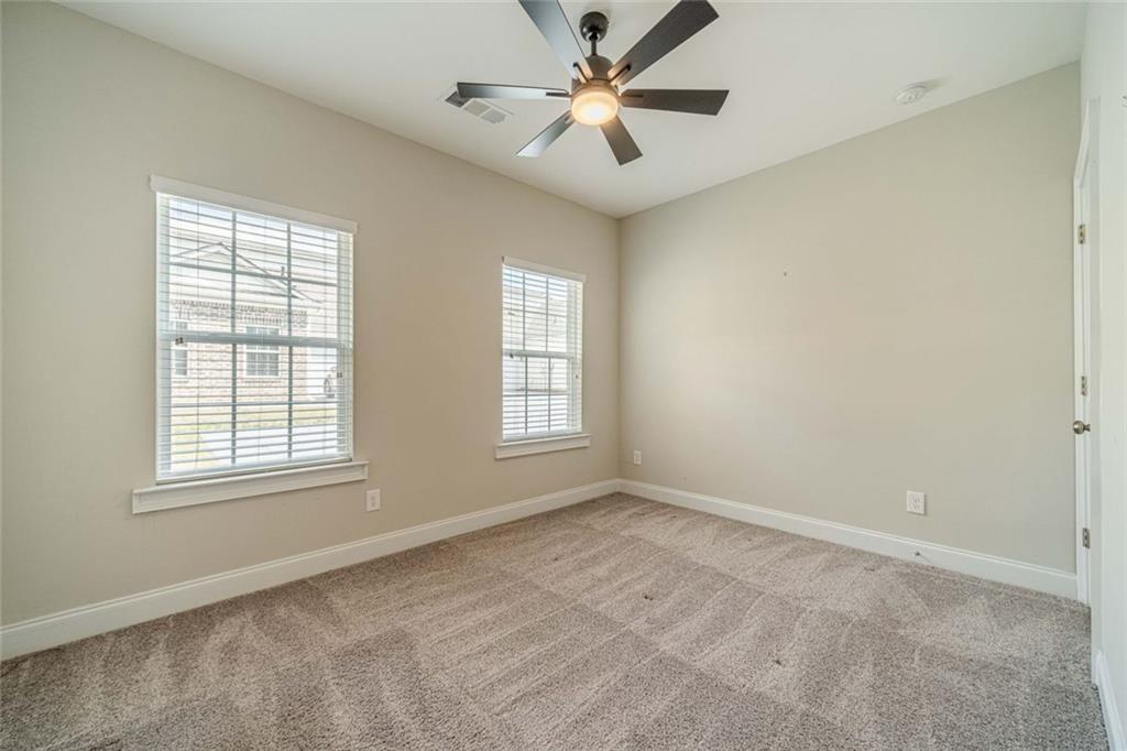 347 Villa Park Circle Stone Mountain, GA 30087 - Photo 18 of 25 a view of an empty room with a window